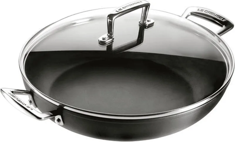 Hapjespan - Sauteuse - met deksel - Les Forgées TNS - ø 26 cm / 2.7 liter - standaard anti-aanbaklaag von Le Creuset in Schwarz – Produktfoto